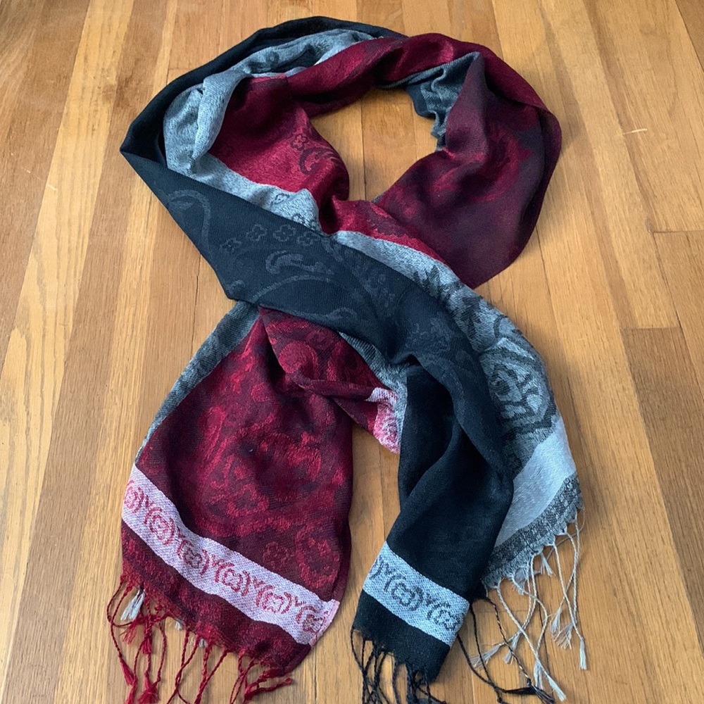 G brand burgundy/gray/black patterned scarf.